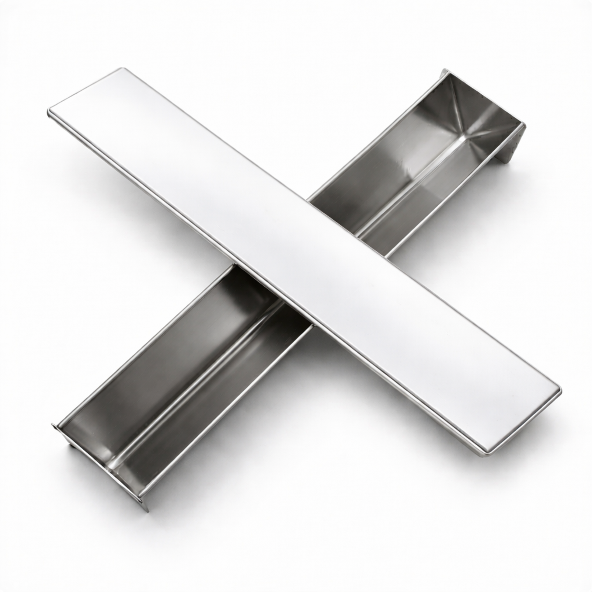 Studio composition of stainless steel triangle terrine mold (V-shape) with lid crossed on top, displaying high-quality metal finish