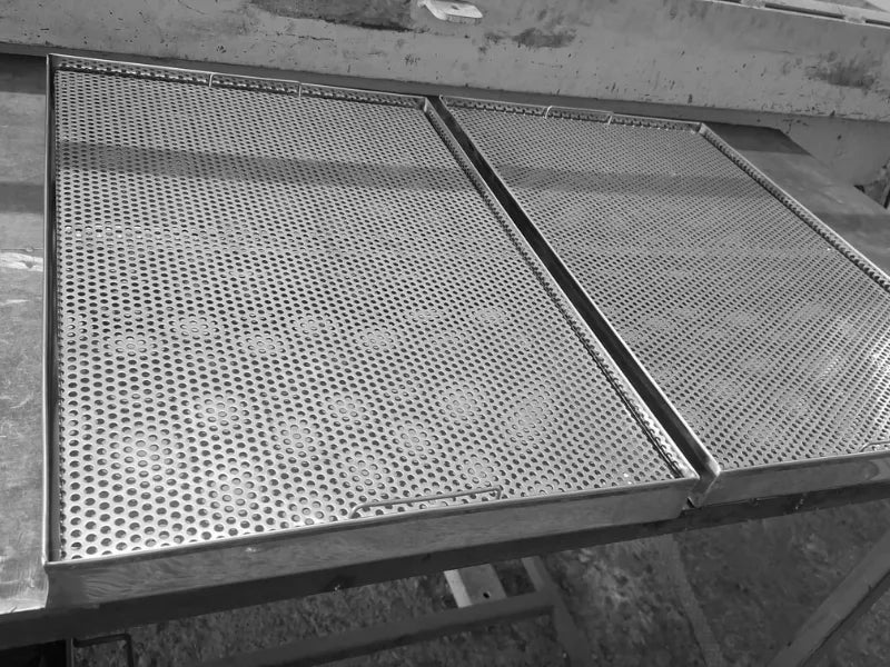 Perforated stainless steel drip tray AISI 304 surface detail for drainage