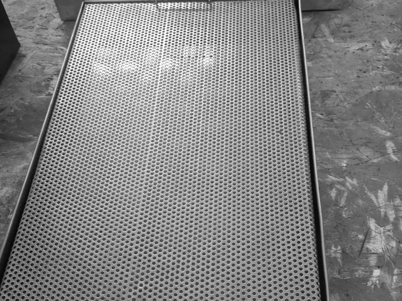 Perforated stainless steel drip tray AISI 304 top view showing drainage surface