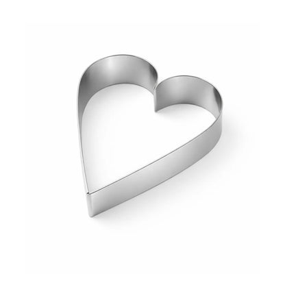 Stainless steel heart pastry ring solid angle view for shaping cakes and desserts on white background
