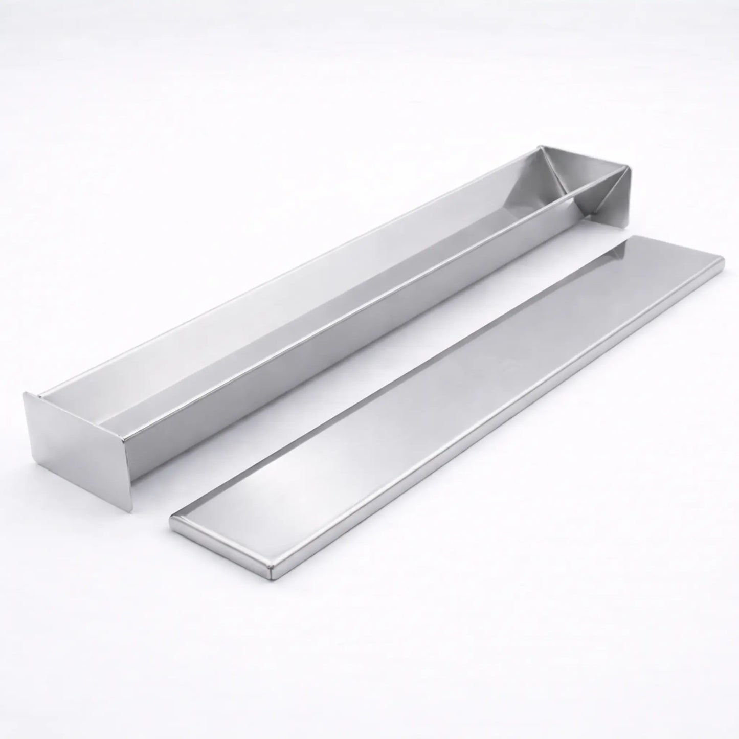 Empty professional stainless steel V-Shape terrine mold resting next to its matching flat lid on a white background, used for triangular shaped foods