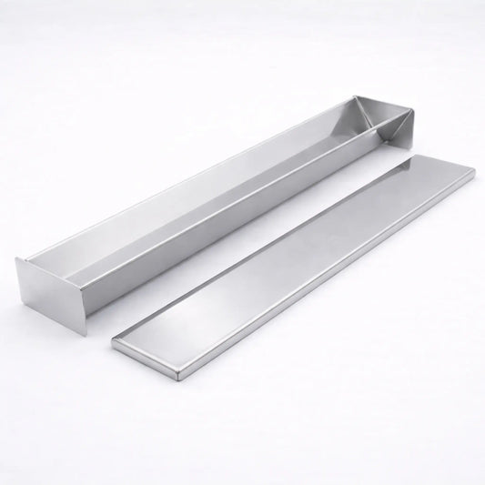 Empty professional stainless steel V-Shape terrine mold resting next to its matching flat lid on a white background, used for triangular shaped foods